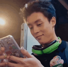 a man wearing headphones and a badge that says ksa on it