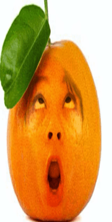 an orange with a face carved into it and a green leaf on top of it