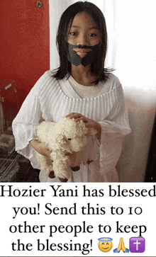 a girl dressed as jesus holding a stuffed sheep