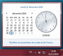 a clock displays the time of 23:59 on december 31st