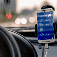 a smart home app is displayed on a phone in a car