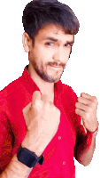 a man wearing a red shirt has his fist up