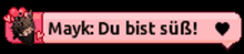 a pink button with mayk du bist süß on it