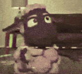 a painting of a sheep with a purple eye