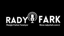 a black and white logo for a radio station with a microphone in the center .