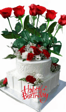 a white birthday cake with red roses and the words happy birthday on it