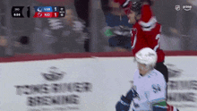 a hockey game is being played between the vancouver canucks and the toronto maple leafs
