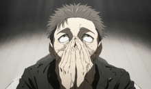 a man is covering his face with his hands and looking up at the sky