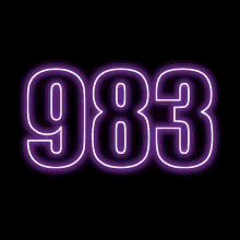 the number 983 is glowing brightly in the dark