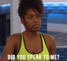 a woman in a yellow sports bra is asking did you speak to me