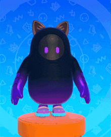 a black and purple stuffed animal with cat ears