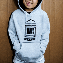 a person wearing a gray hoodie with a jiafe logo on it