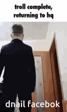 a man in a suit is walking towards a door that says troll complete returning to hq on the bottom