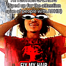 a man wearing sunglasses and a red shirt that says fix my hair on it