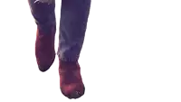 a person wearing cowboy boots and jeans is walking