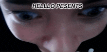 a close up of a person 's eyes with the words hello presents written above them