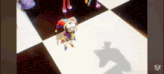 a cartoon character is standing on a checkered floor and his shadow is on the floor .