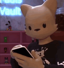 a stuffed animal wearing a cat mask is holding a cell phone