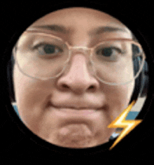 a woman wearing glasses is making a funny face in a circle with a lightning bolt .