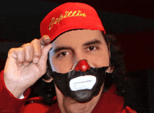 a man wearing a red hat with the word papillon on it