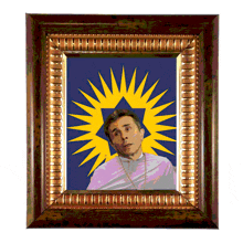 a framed picture of a man with a yellow star on his head