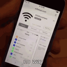 a person is holding a cell phone that says wifi anywhere