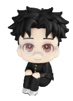 a figurine of a boy with black hair and glasses is sitting down