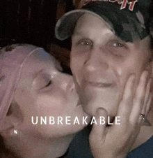 a woman is kissing a man on the cheek with the words unbreakable written below them