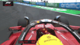 lewis hamilton is driving a red ferrari race car
