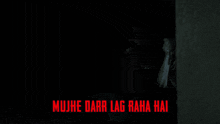 a man in a dark room with the words mujhe darr lag raha hai on the bottom