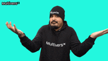 a man wearing a black hoodie that says multivers on the front