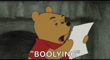 winnie the pooh is holding a piece of paper that says ' boogying ' on it