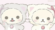 two teddy bears are standing next to each other with buttons on their faces