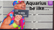 a man in a colorful outfit holds up a sign that says lapd and ken