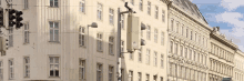 a row of buildings with a traffic light on the corner