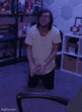 a person is kneeling down in front of a television in a room with imgflip.com written on the bottom