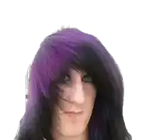 a person with purple and black hair is making a funny face .