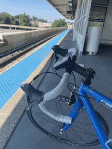 a blue bicycle with the word car on the front wheel