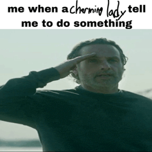 a man salutes in front of a meme that says me when a charming lady tell me to do something