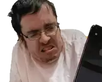 a man with glasses and a beard looks at a cell phone