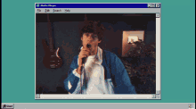 a computer screen shows a man singing into a microphone