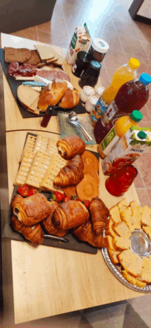 a table full of food including a bottle of tropicana