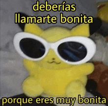 a yellow stuffed animal wearing sunglasses and the words `` deberias llamarte bonita porque eres muy bonita ''