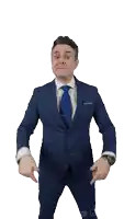 a man in a suit and tie is pointing at the camera and smiling