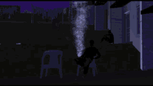 a man sits in a chair in front of a house with smoke coming out of it