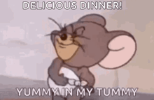 jerry from tom and jerry is smiling and holding his belly .