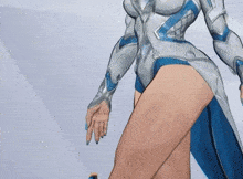 a close up of a woman 's legs and thighs in a white and blue outfit .