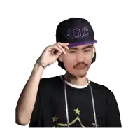 a man wearing a purple w.o.c hat