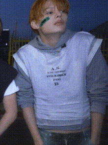 a man wearing a white shirt that says " a.s. " on it