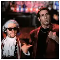 a man wearing a wig and sunglasses stands next to another man in a suit